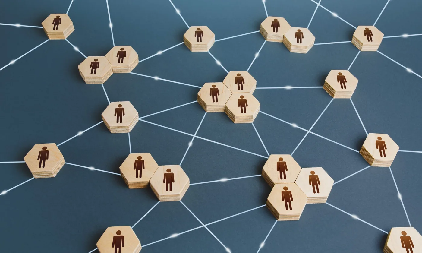 An abstract network of interconnected points representing people linked to services.