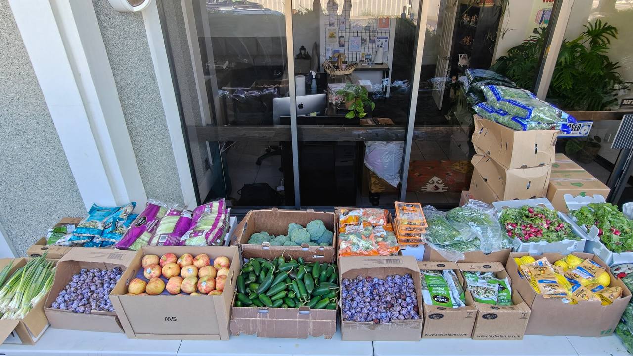 Boxes of fresh produce set out for SSA's weekly Food Bank, in partnership with Second Harvest.