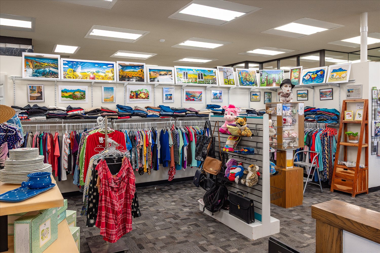The International Resource Center floor at SSA, with organized racks of clothing and household items.
