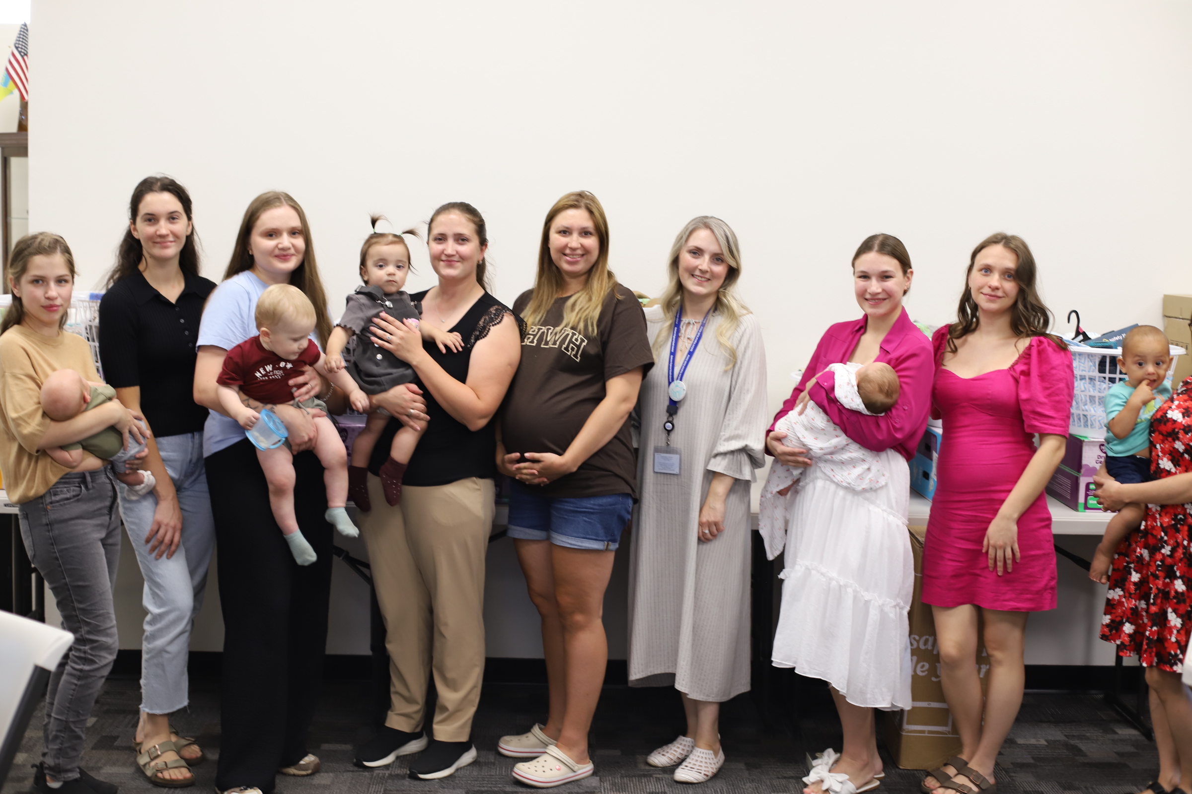Mothers and their babies with an SSA staff member at a community event hosted at Spokane Slavic Association.