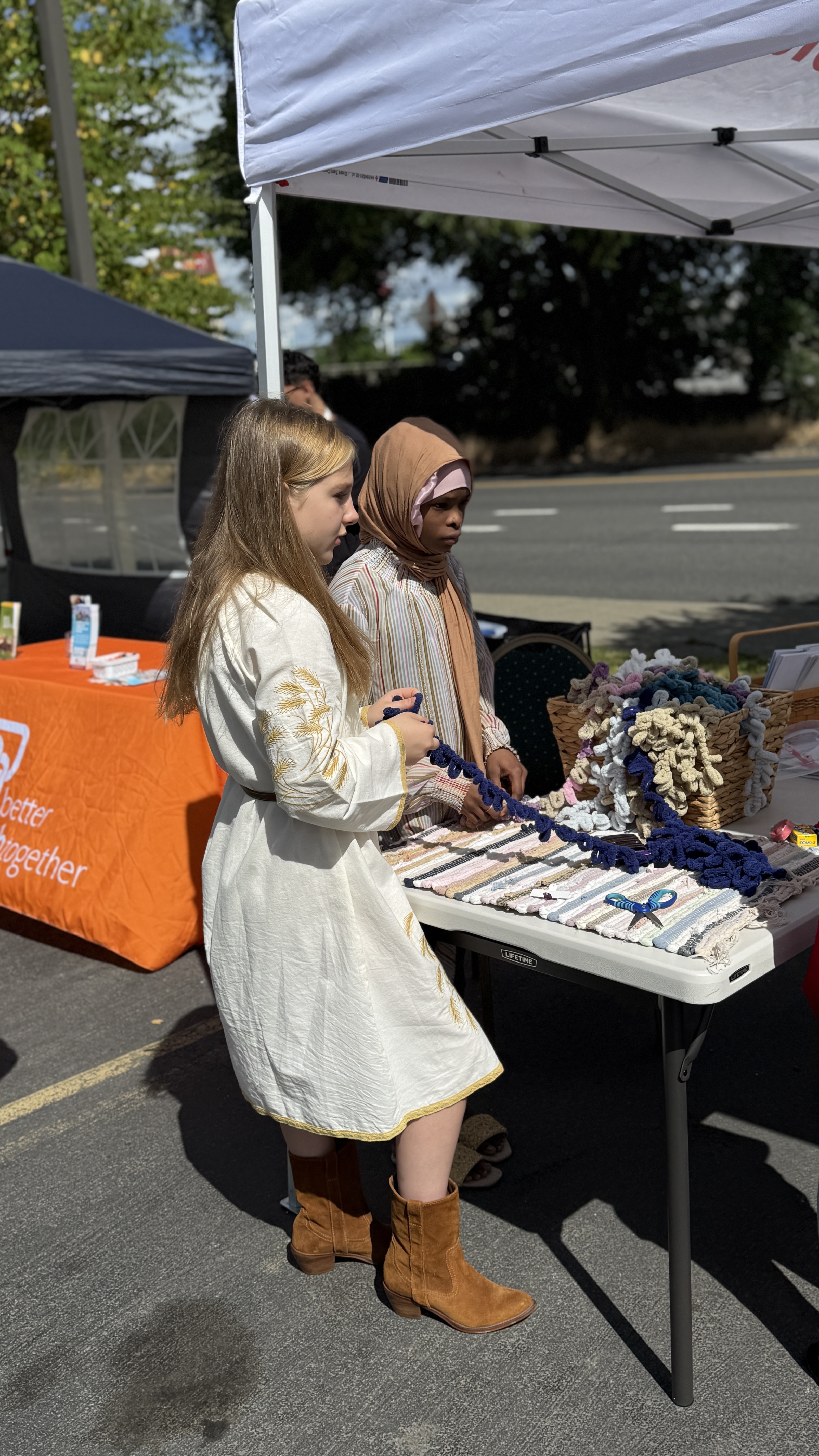 A partner organization representative shares information at Refugees Day.