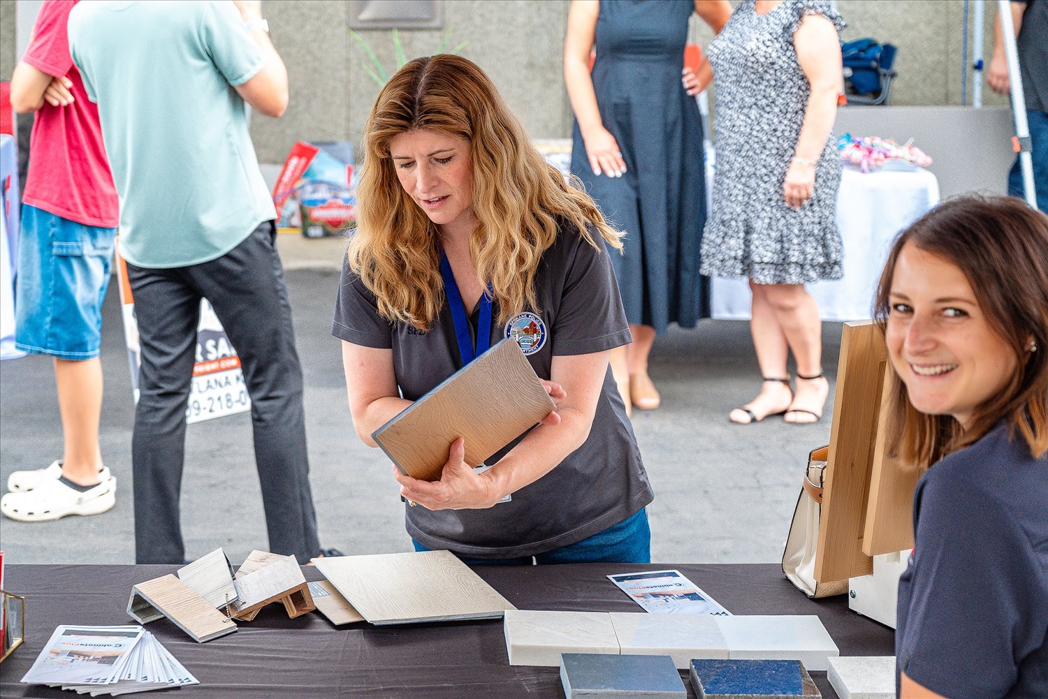 A business owner sharing product samples at a community event.