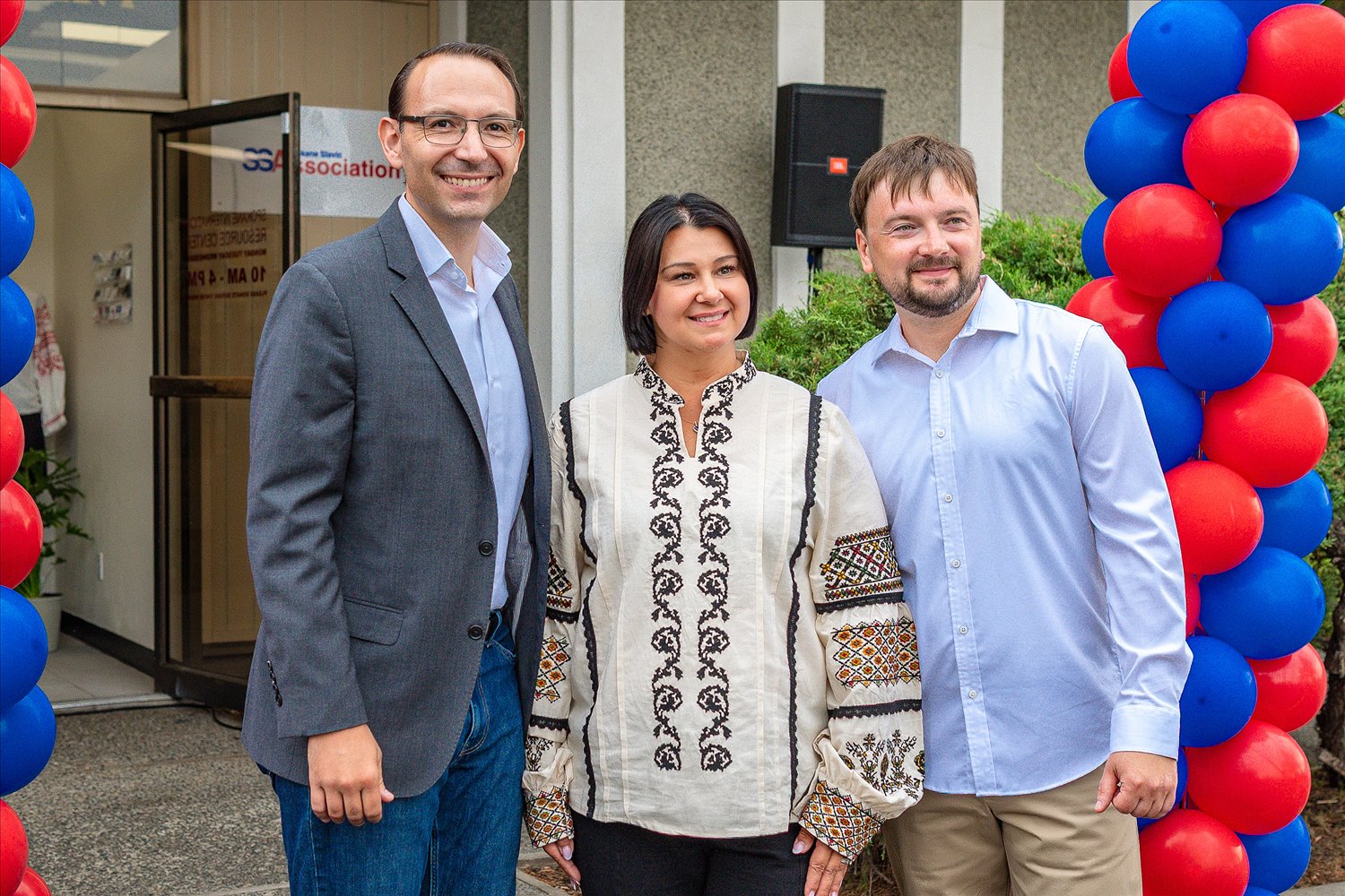 Community members celebrating outside Spokane Slavic Association's International Resource Center at its grand opening.