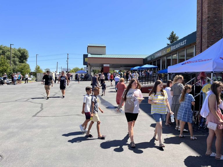 A large, diverse crowd of community members gathered at the Thrive International Event.
