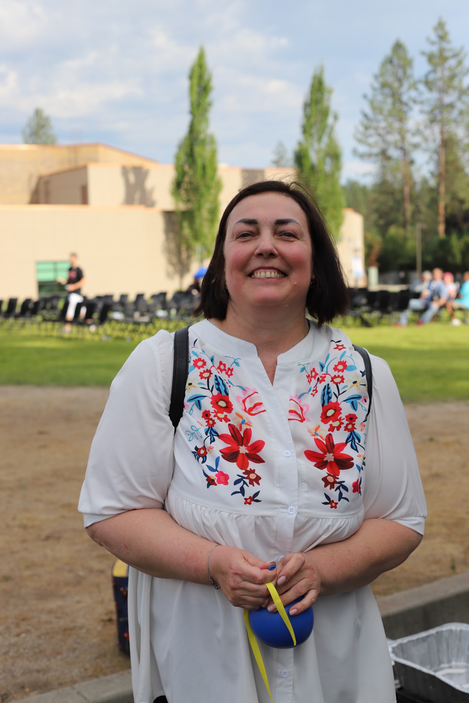 A woman in a traditional embroidered blouse at SSA's UA-Fest celebration.